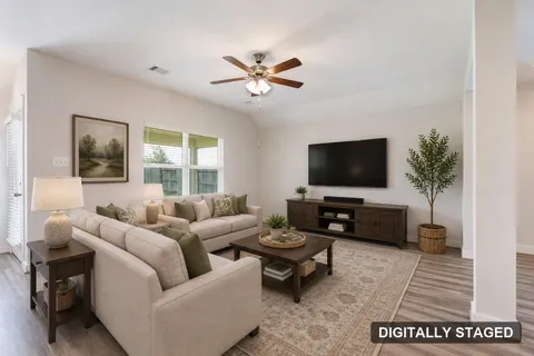 Living room, digitally staged to show furniture placement (digitally staged)
