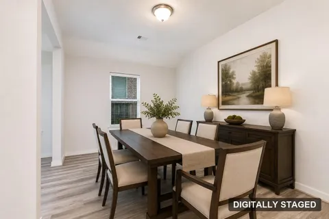 Flex room shown staged as a formal dining room (digitally staged)