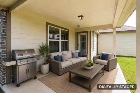 Covered back patio, digitally staged with furniture (digitally staged)