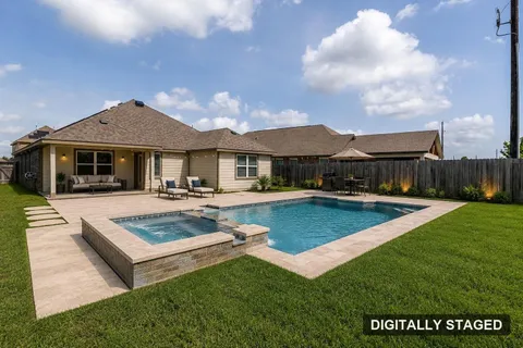 Backyard digitally staged with a rendered pool concept — no pool exists on the property (digitally staged)