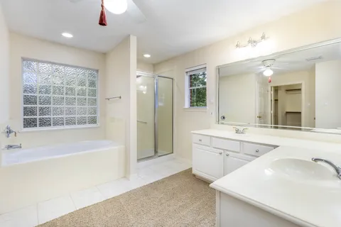 Primary bathroom with soaking tub and separate shower