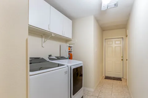 Utility room with washer/dryer included