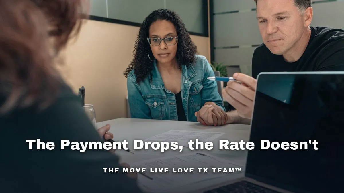 A couple reviewing mortgage paperwork and a laptop at a bright kitchen table in the morning