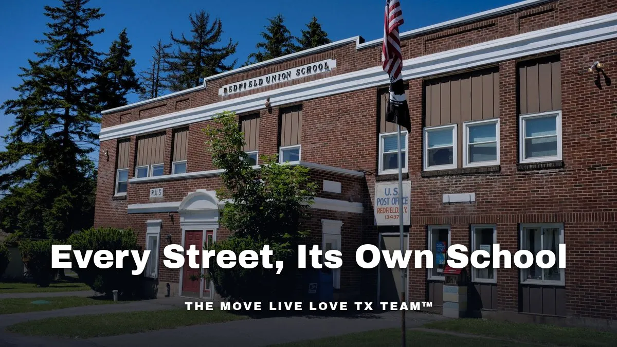 A bright American high school building exterior on a sunny morning, with a clear blue sky.